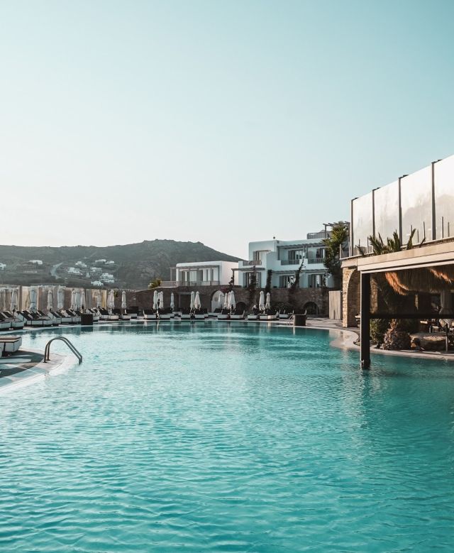 Relax poolside, soak up the sun, and then drift on over to Lagoon swim-up bar for a delicious fresh fruit smoothie or ice-cold cocktail. We think you could get used to this. 🍹
.
.
.
#RoyalMyconian #MyconianCollection #LeadingHotelsoftheWorld #luxuryhotel #Mykonoshotel #Mykonoslife #thegoodlife #MyconianLife #MyconianLifestyle #poolside #poolbar #summervibes #bestvacations #holidaygoals #summerinGreece #Mykonos #wishiwasthere